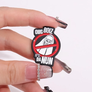 Funny enamel lapel pin featuring a nun within a red prohibition sign and OMG BOIZ text