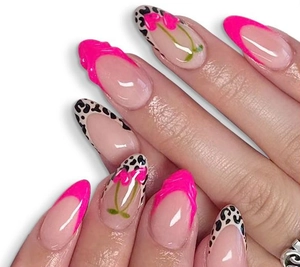 Detail of almond press-on nails featuring 3D cherry art and leopard French tips