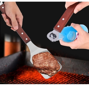Stainless steel barbecue spatula with wooden handle, 2-in-1 grill flipper with bottle opener.