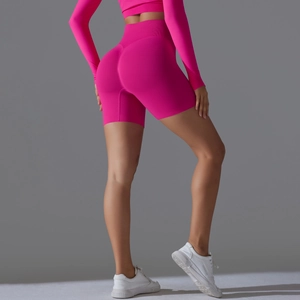 Rear view of seamless rose red high waist yoga shorts and long sleeve gym set