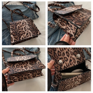 Detailed close-up showing leopard print bag texture, magnetic buckle, and interior storage