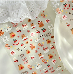 Detail of Christmas nail stickers with cute reindeer, snowman and 25th Dec labels