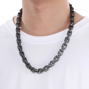 Close-up of vintage punk textured square chain necklace in black silver on male model