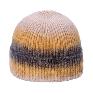 Detail of soft mohair knit texture and pink yellow gradient on a ribbed beanie