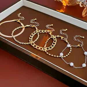 Elegant 6-piece gold plated pearl bracelet set featuring snake, rope, and curb chains
