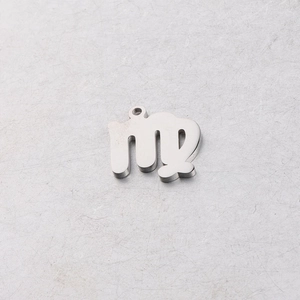Macro detail of 15mm mirror polished stainless steel Virgo constellation pendant charm
