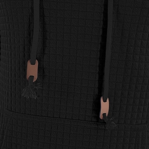 Detail of waffle knit fabric and black drawstring with brown leather slider adjustment