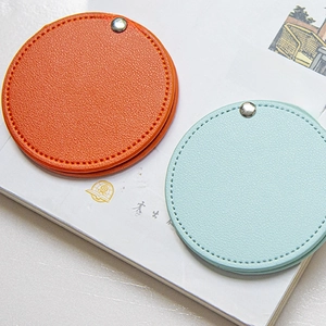 Minimalist portable PU leather handheld makeup mirror with soft stitching in orange and blue