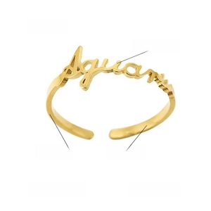 Macro view of gold Aquarius zodiac ring showing 1mm thickness and 1.8mm width specs