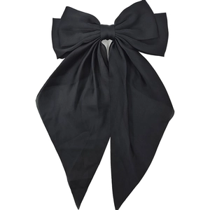 Elegant large black satin bow hair clip with long ribbons on a white background