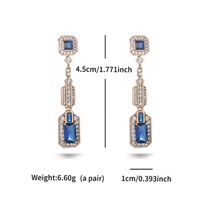 Art Deco style blue zircon drop earrings in gold frame showing size and weight specs