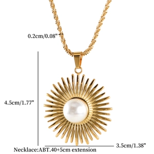 Macro view of gold sunburst pearl necklace with 4.5cm pendant and 40cm chain details