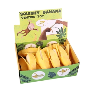 Realistic peeling banana squishy stress relief toy set in a yellow display box