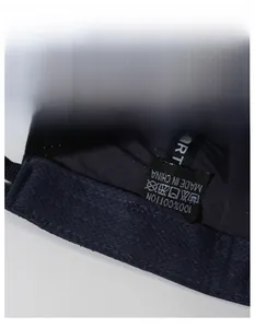 Detail of breathable inner sweatband and 100% cotton wash label of navy baseball cap