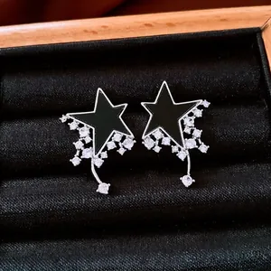 Minimalist silver star earrings with black shell inlay and sparkling zircon tassels