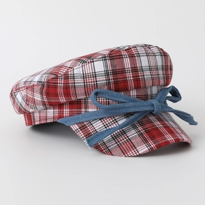 Japanese style red plaid baker boy hat with a navy denim bow tie, side view