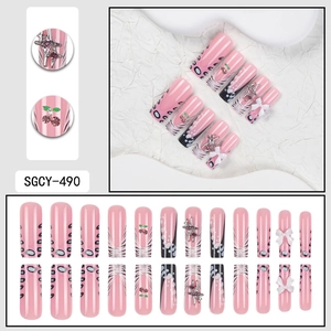 French leopard print press-on nails with 3D bows and silver charms in 24-piece set