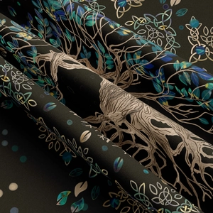 Macro shot of Celtic Tree of Life tapestry fabric with intricate blue and green knot patterns