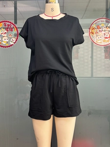 Close-up of black casual two-piece set with crewneck top and drawstring shorts