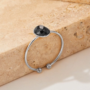 Elegant adjustable silver stainless steel ring with a faceted black onyx stone