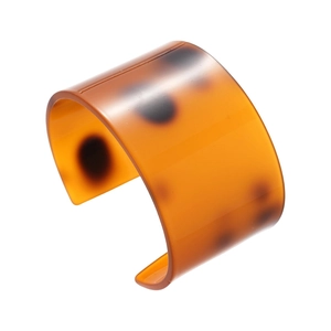 Minimalist wide acetate cuff bracelet with tortoiseshell pattern on white background