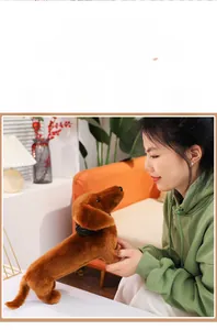 Realistic dark brown dachshund plush toy with black collar shown in cozy home setting