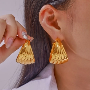 Golden fan-shaped pleated stud earrings with a 3D textured metallic shell design