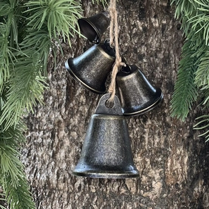 Set of 4 vintage copper Christmas bells on rustic jute rope for festive home door decor