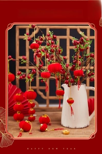 Detailed view of red flocked mini lanterns with golden base and silk tassels for New Year