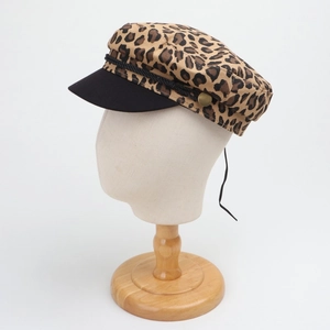 Fashionable leopard print paneled military cap with black brim and gold buckle detail
