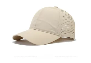 Detail of laser-cut breathable holes on beige quick-dry baseball cap side view