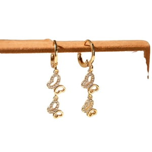 Elegant gold butterfly dangle earrings with sparkling zircon stones in a vertical design