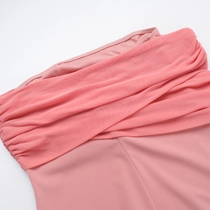 Detail of pink mesh layers and knit fabric texture on an off-shoulder dress