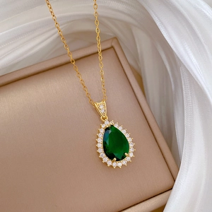 Retro gold teardrop necklace with emerald green stone and sparkling zircon halo