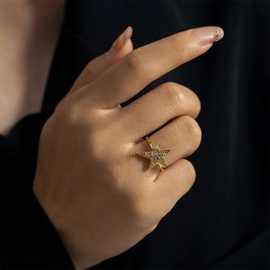 Elegant gold-tone S925 silver ring featuring a micro-paved sparkling zircon star on hand