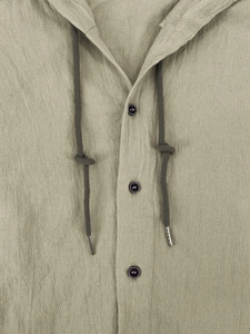 Detail of khaki linen shirt featuring a three-button placket and drawstring hood