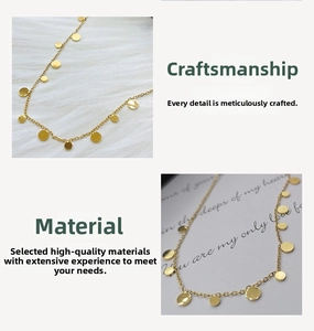 Detailed macro of a gold dainty necklace featuring polished round disc pendants on thin chain