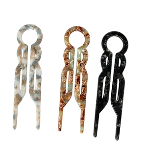 Three-piece set of acetate U-shaped hairpins in marble, tortoiseshell, and black finish