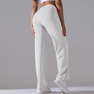 Macro shot of high waist white yoga wide-leg pants showing premium fabric texture