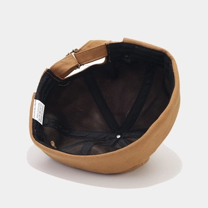Vintage brown cotton docker cap with adjustable strap and 6-panel structure from top view
