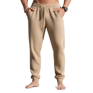 Men's khaki waffle knit joggers with elastic drawstring waist and ribbed ankle cuffs