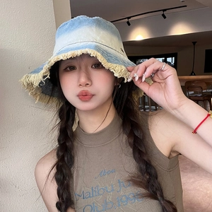 Faded light blue denim bucket hat with yellow frayed edges and a vintage sunshade design