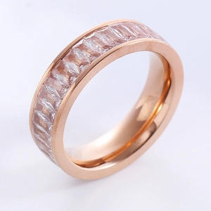Rose gold stainless steel wide band ring featuring continuous step-cut clear zircons