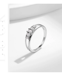 Macro shot of s925 silver double-layered ring with rectangle and round zircon stones