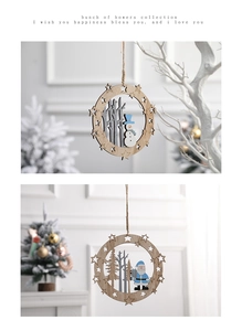 Detail of wooden Christmas ornaments with cutout Santa and snowman designs for holiday decor