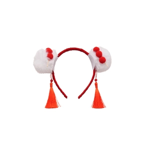 Festive red velvet headband with white fluffy pom poms and long tassels for Lunar New Year