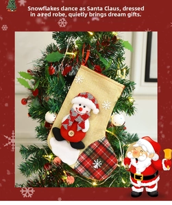 Close-up of a burlap Christmas stocking with 3D snowman, plaid accents and snowflakes