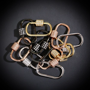 Detailed macro of crystal-studded spiral clasps in gold, silver, rose gold, and black finishes
