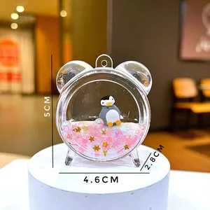 Detail showing dimensions of the penguin themed quicksand acrylic desktop ornament charm