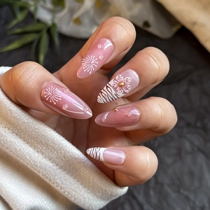 Press-on nails with 3D pink flowers, zebra stripes, and nude pink almond shape design